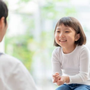 japanese girl playing with a nursery teacher