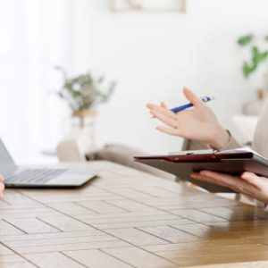 Asian woman interviewing a man